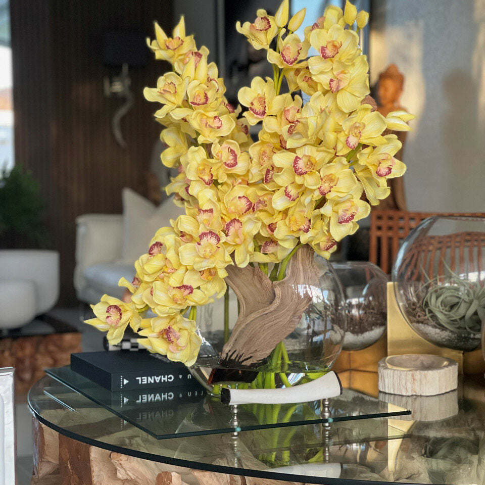 Yellow Cymbidium Orchids in Moon Vase